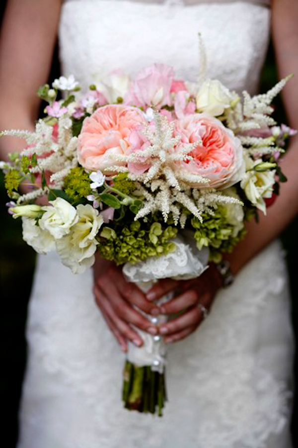 bride holds assorted pink and white bouquet - charming Hudson Valley NY wedding photo by top New York wedding photographers Belathee Photography
